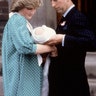 Princess Diana and Prince Charles look at their newborn son Prince William as they leave St. Mary's Hospital, in London, June 22, 1982