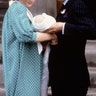 Princess Diana and Prince Charles look at their newborn son Prince William as they leave St. Mary's Hospital, in London, June 22, 1982