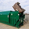 Trash compactor makes 10-foot logs