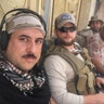 Ephraim Mattos waiting for a ride to the front lines with a few Iraqi soldiers, May 2017