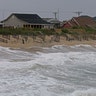 Rising tides move closer to the dunes in Kill Devil Hills, North Carolina, Thursday