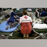 Volunteer Lisa Black comforts Janice Forse at the emergency shelter at the Beaumont Civic Center in Beaumont, Texas, Wednesday