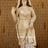 A limestone statue of a woman dressed with a cloak, found at Hatra