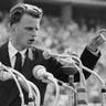 Evangelist Billy Graham speaks to over 100,000 Berliners at the Olympic Stadium in Berlin, Germany, June 27, 1954