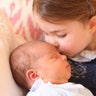 Britain's Princess Charlotte cuddles her brother Prince Louis, on her third birthday, at Kensington Palace, in London, May 2, 2018