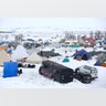 People walk through the Dakota Access Pipeline protest camp on the edge of the Standing Rock Sioux Reservation.