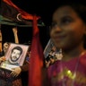 Aug_24_Libyan_Woman_Holding_Photo_of_Dead_Brother