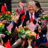 President Donald Trump and China's President Xi Jinping greet people in Beijing, China, Thursday