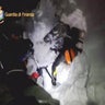 A photo taken from a video shows a rescuer entering the Hotel Rigopiano in Farindola. 