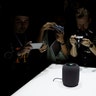 People photograph a prototype Apple HomePod during the annual Apple Worldwide Developer Conference