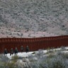 U.S. Border Patrol agents on horseback head out on patrol along the U.S.-Mexico border fence near Jacumba, California.