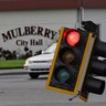 Motorists drive around a downed traffic light from winds from Hurricane Irma Monday, in Mulberry, Fla
