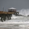 Waves crash around the Oceana Pier as the outer edges of Hurricane Florence being to affect Atlantic Beach, North Carolina, Thursday
