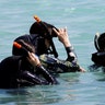 Tourists snorkel on the waters off Tumon beach, August 11, 2017.  