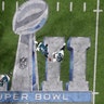 Philadelphia Eagles quarterback Nick Foles hands off to running back LeGarrette Bloun in Super Bowl 52 in Minneapolis