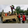 Texas National Guard soldiers aid residents in heavily flooded areas from the storms of Hurricane Harvey in Houston, Sunday