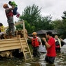 Texas National Guard soldiers aid residents in heavily flooded areas from the storms of Hurricane Harvey in Houston, Sunday
