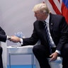 President Donald Trump shakes hands with Russian President Vladimir Putin at the G-20 Summit, Friday, July 7, 2017, in Hamburg, Germany
