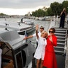 Brigitte Macron, wife of French President Macron, and First Lady Melania Trump after a boat tour on the Seine River in Paris