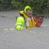 Wilford Martinez is rescued from his flooded car along Interstate 610 in floodwaters from Tropical Storm Harvey Sunday, in Houston, Texas