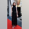 Fashion icon Olivia Palermo looks super chic in a black top and fringe skirt as she poses on the red carpet for the Peninsula Paris' &amp;quot;Made in California&amp;quot; Summer Party on June 26, 2018.&amp;nbsp;