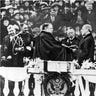 Woodrow Wilson takes the oath of office for his first term of the presidency on the East Portico at the U.S. Capitol in Washington, D.C.. Chief Justice is Edward D. White on March 4, 1913.