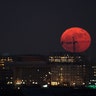 The moon is seen as is rises in Washington, DC, December 3