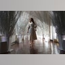 First lady Melania Trump walks along the East Colonnade of the White House, which has been decorated with the theme 