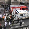 In this photo provided by Sheng Zihao, an unidentified wounded person is taken into an ambulance in Paris, Friday, Feb. 3, 2017. 