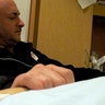 Gifford and Mark Kelly hold hands at bedside