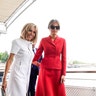 US First Lady Melania Trump and French president's wife Brigitte Macron depart after a boat trip down the River Seine in Paris