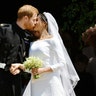 Prince Harry and Meghan Markle kiss on the steps of St George's Chapel in Windsor Castle after their wedding, May 19, 2018