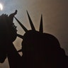 A partial solar eclipse is seen near the Statue of Liberty on Liberty Island in New York