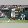 Switzerland’s Roger Federer hits a return during the men's Wimbledon final against Croatia’s Marin Cilic in London