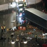 A used suit of a forensic investigator lies on a Christmas tree where a truck ploughed through a crowded Christmas market killing 12 people in the west of Berlin.