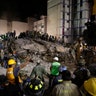 Rescue workers search for people trapped in a collapsed building in the Piedad Narvarte neighborhood of Mexico City, Tuesday