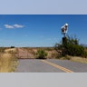 A road abruptly ends next to a sign for a cattle ranch near Douglas, Arizona, United States.
