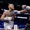 Floyd Mayweather Jr., and Conor McGregor during their super welterweight boxing match in Las Vegas