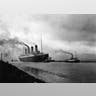 The SS 'Titanic', leaving Belfast to start her trials, pulled by tugs, shortly before her disastrous maiden voyage of April 1912. (Photo by Topical Press Agency/Getty Images)