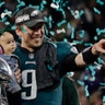 Philadelphia Eagles quarterback Nick Foles holds his daughter, Lily James, after winning Super Bowl 52 in Minneapolis, February 4