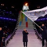 Beijing mayor Chen Jining, host city for the 2022 Winter Olympics, waves the Olympic flag during the 2018 Winter Olympics in Pyeongchang