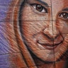 Artist Sam Welty creates a chalk mural of Heather Heyer during her memorial