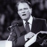 Evangelist Billy Graham preaches to thousands of believers at Bercy's Stadium in Paris, September 20, 1986