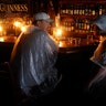 People sit at a bar that has no power and drink during a Hurricane Party in Wilmington, North Carolina, Friday