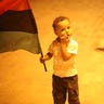 Boy_holds_libya_flag