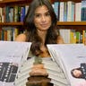 Diane_Guerrero_posing_with_book