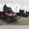 Armored car joins a parade celebrating the liberation of the eastern section of Mosul.