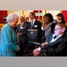 Britain's Queen Elizabeth (L) greets Stephen Hawking at a charity event in London 