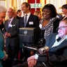 Britain's Queen Elizabeth (L) greets Stephen Hawking at a charity event in London 