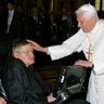 Pope Benedict XVI (R) greets British professor Stephen Hawking during a trip to the Vatican in 2008.